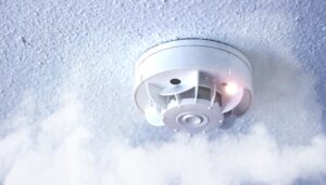 Smoke detector with smoke in the air.